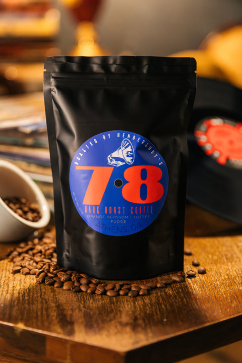 78 Zero-Emission Micro-Roasted Sustainable Dark Roast Coffee | Premium Specialty Coffee | Best coffee in Athens GA | Front of black package sitting on table of coffee beans