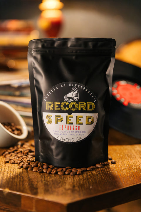 Record Speed Zero-Emission Micro-Roasted Sustainable Espresso Blend Coffee | Premium Specialty Coffee | Best coffee in Athens GA | Front of black package sitting on table of coffee beans