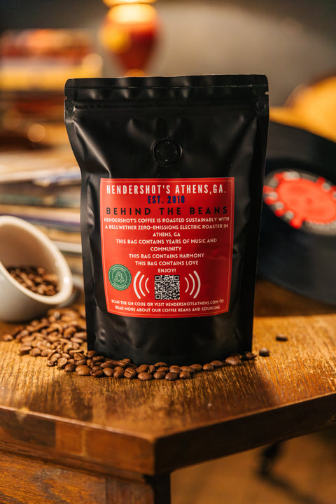 33 1/3 Zero-Emission Micro-Roasted Light Roast Coffee | Premium Specialty Coffee | Best coffee in Athens GA | Back of black package sitting on table of coffee beans