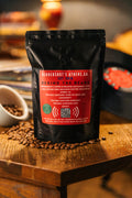 45 Zero-Emission Micro-Roasted Sustainable Medium Roast Coffee | Premium Specialty Coffee | Best coffee in Athens GA | Back of black package ​​sitting on table of coffee beans