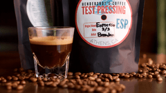 A picture of a bag of Hendershot's Test Press espresso with a shot of espresso